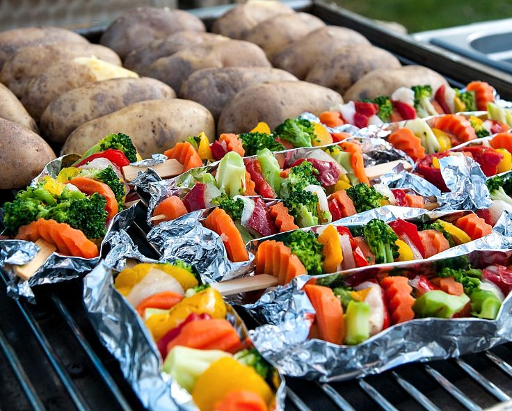 Using foil 'boats' helps to keep the vegetables together and slows the cooking rate 